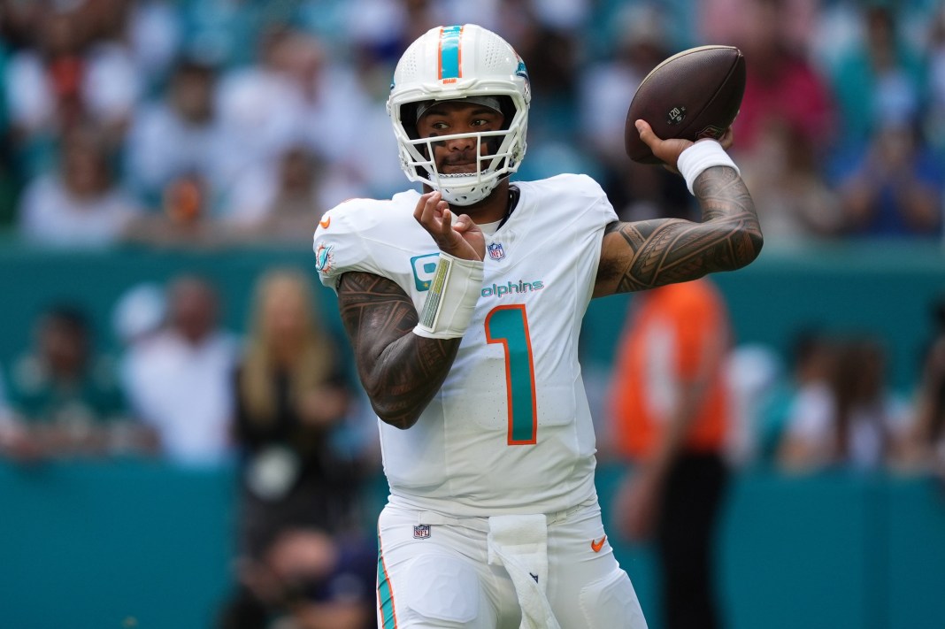 Miami Dolphins quarterback Tua Tagovailoa attempts a pass against the New England Patriots
