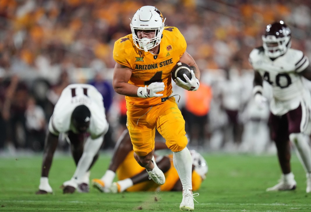 Arizona State star Cam Skattebo runs the ball against Mississippi State during the 2024 college football season.