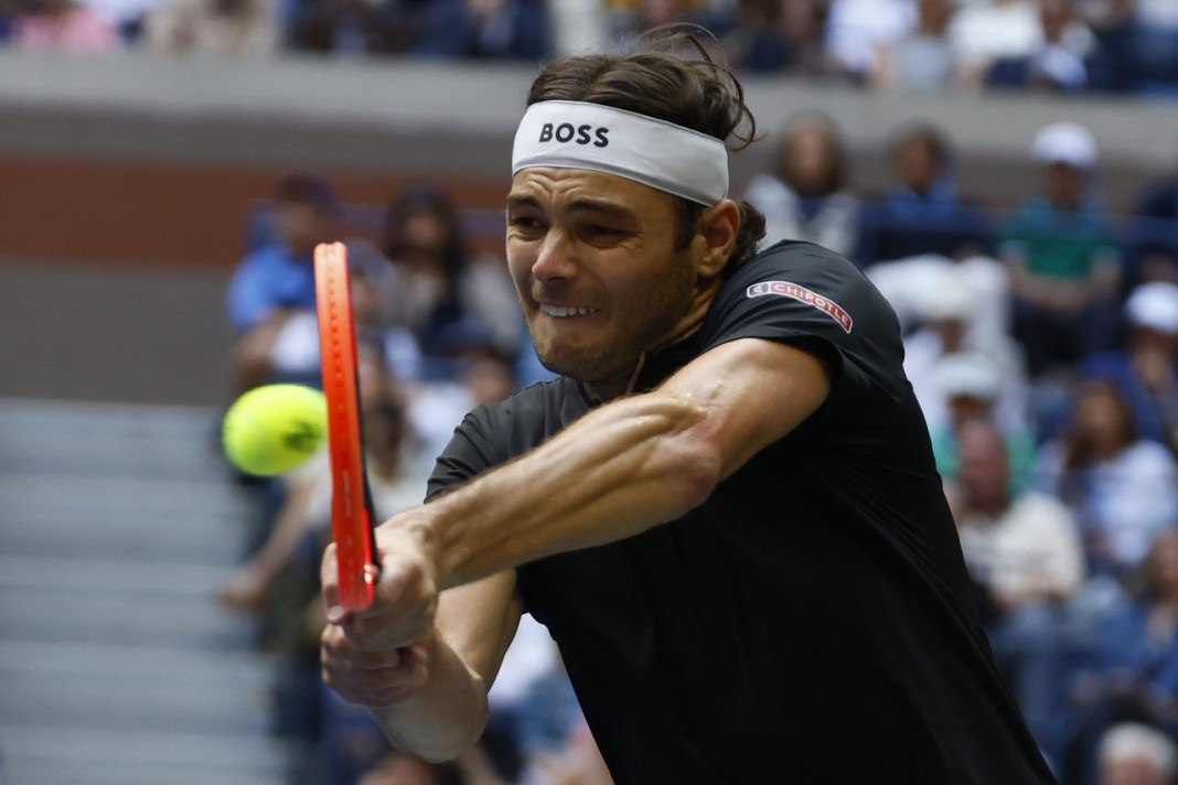 Taylor Fritz hits a backhand in his match against Jannik Sinner in the 2024 US Open final.