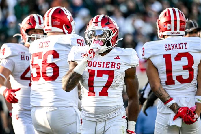Indiana's Ty Son Lawton silences the crowd after a touchdown run against Michigan State