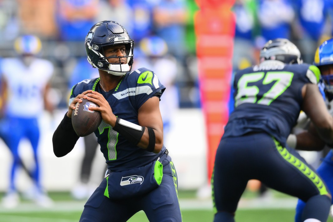 Seahawks quarterback Geno Smith looks to throw a pass in a meeting with the Rams during the 2024 NFL season.