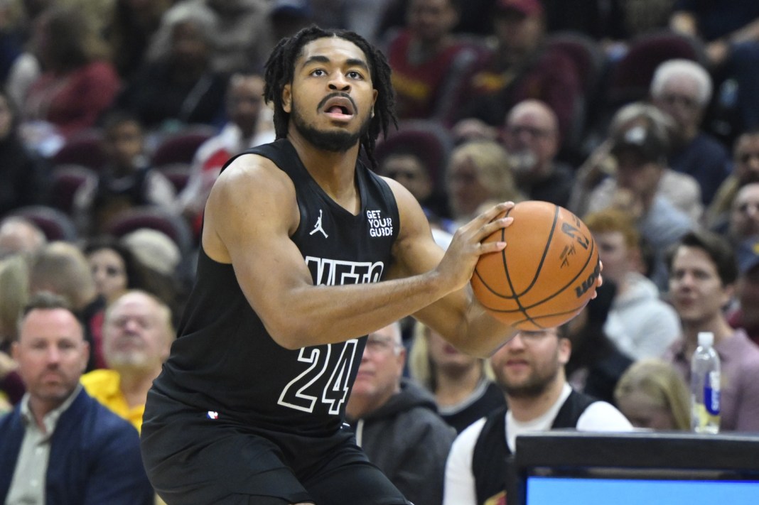 Nets guard Cam Thomas takes a shot against the Cavaliers in the 2024-25 NBA season.