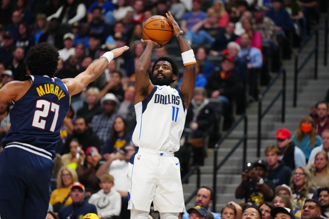 Mavericks star Kyrie Irving takes a shot against the Nuggets in the 2024-25 NBA season.