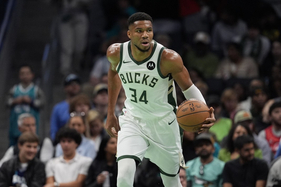 Bucks star Giannis Antetokounmpo brings the ball up in a meeting with the Hornets in the 2024-25 NBA season.