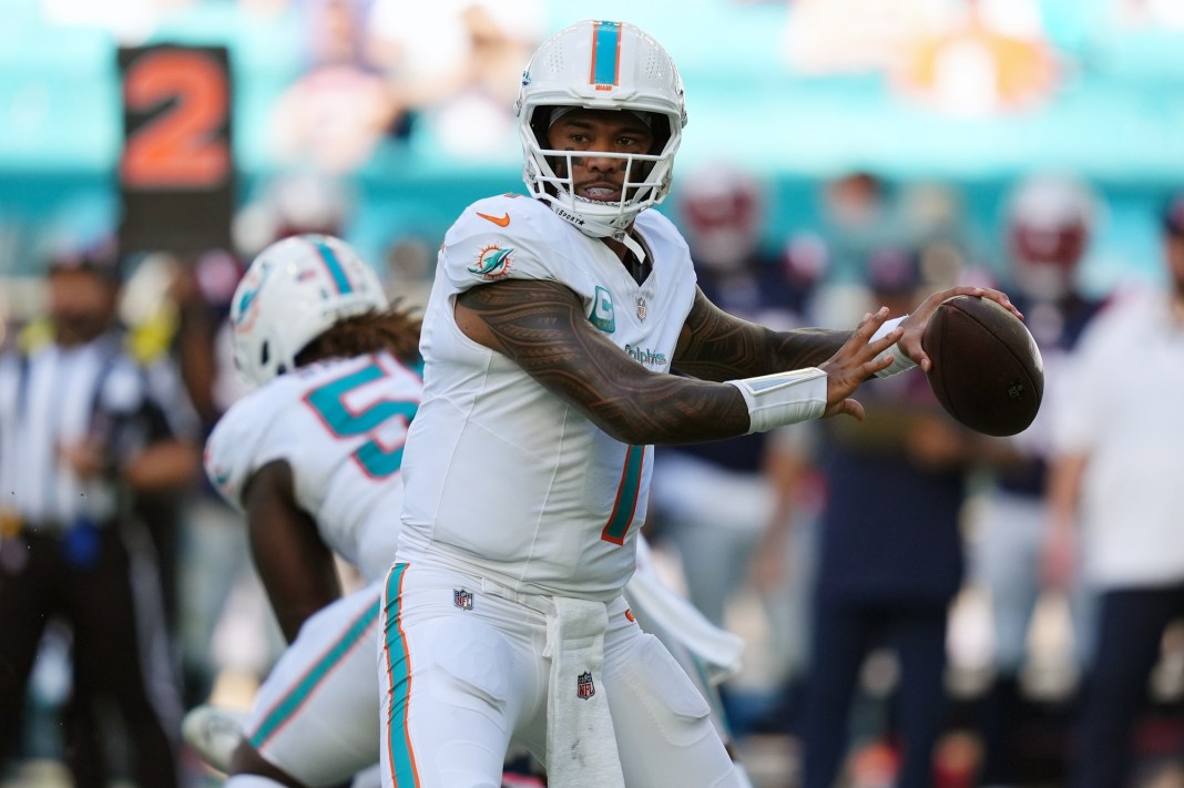 Dolphins quarterback Tua Tagovailoa throws a pass in a meeting with the Patriots during the 2024 NFL season.