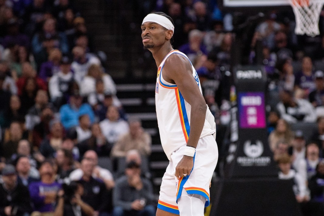 Thunder star Shai Gilgeous-Alexander looks to the bench after making a shot against the Warriors during the 2024-25 NBA season.