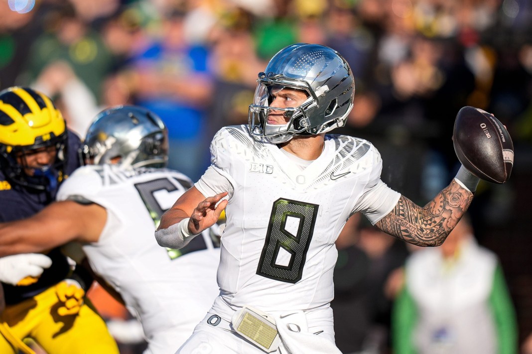 Oregon quarterback Dillon Gabriel makes a pass against Michigan during the first half at Michigan Stadium in Ann Arbor