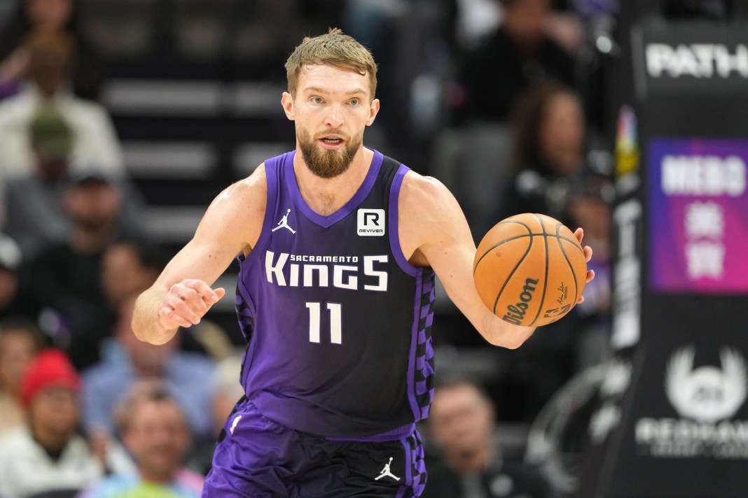 Sacramento Kings forward Domantas Sabonis (11) dribbles against the Utah Jazz