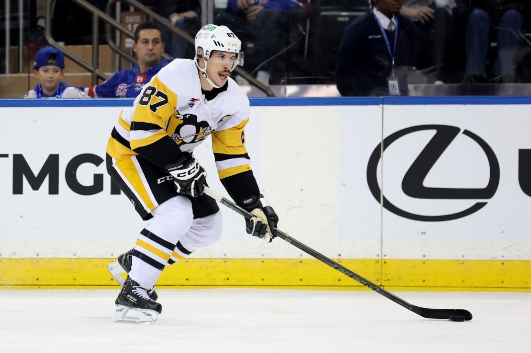 ittsburgh Penguins center Sidney Crosby skates with the puck against the New York Rangers