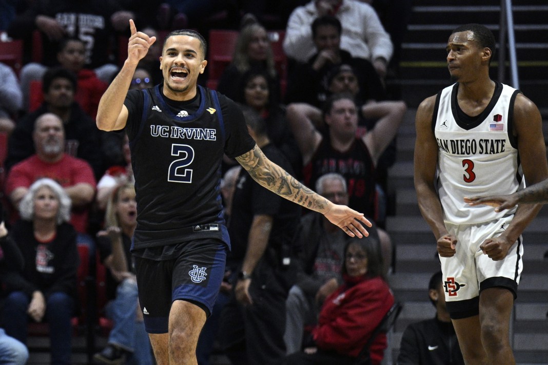 UC Irvine Anteaters guard Justin Hohn (2) celebrates during the second half in front of San Diego State Aztecs guard Micah Parrish (3) at Viejas Arena on December 9, 2023