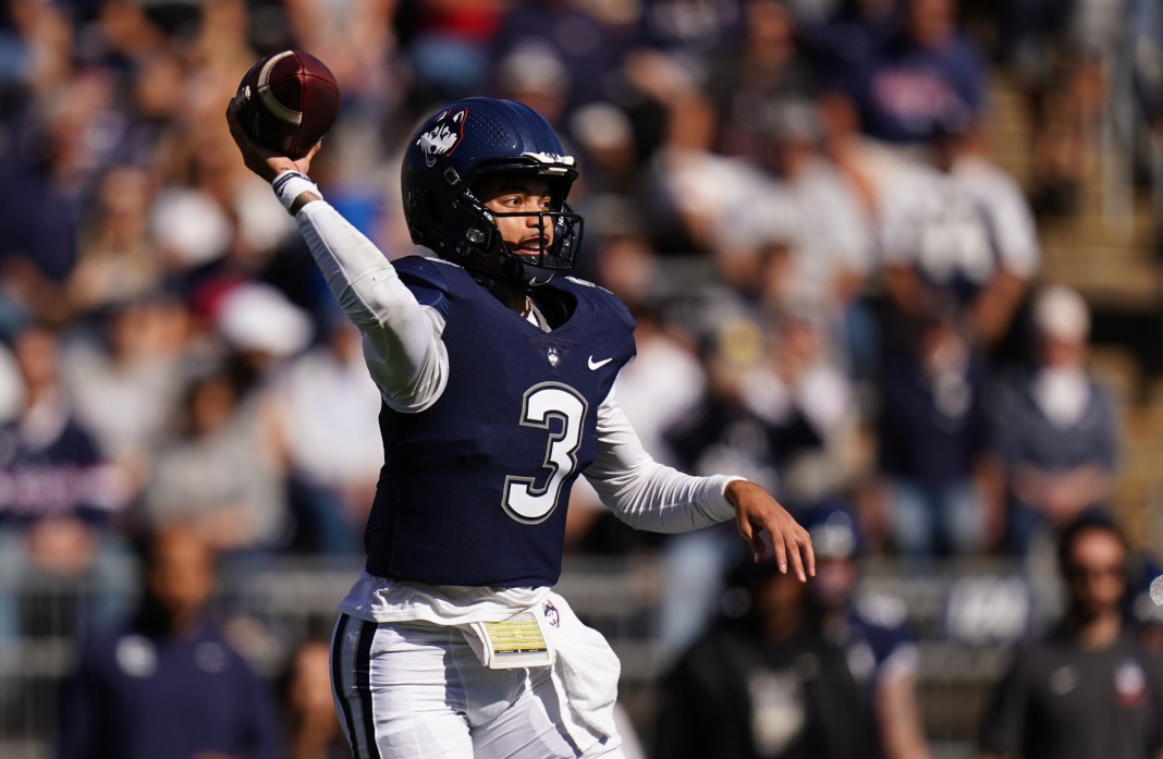 UConn quarterback Nick Evers throws a pass during the 2024 college football season.