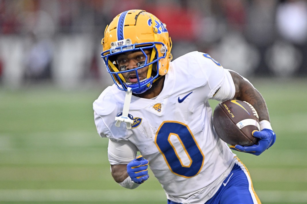 Pittsburgh running back Desmond Reid runs the ball against Louisville during the 2024 college football season.