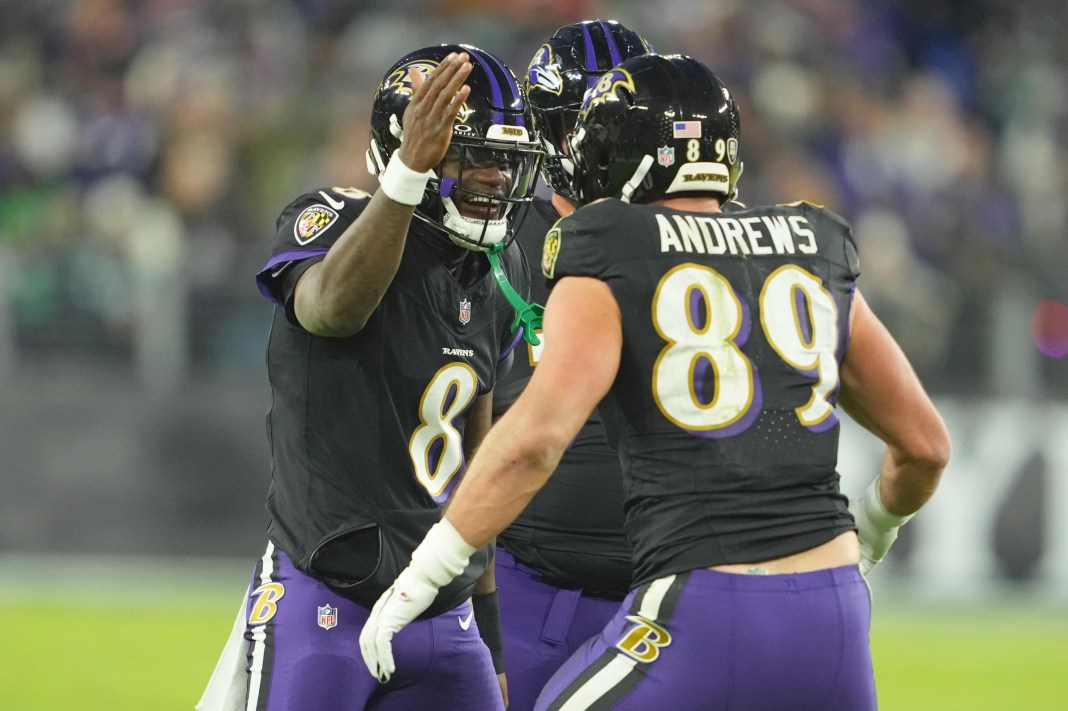 Ravens quarterback Lamar Jackson celebrates a big play with his teammates during the 2024 NFL season.