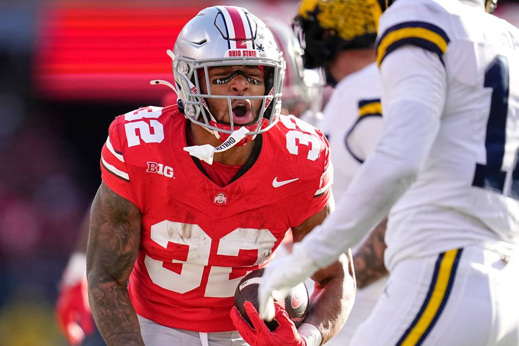 Ohio State Buckeyes running back TreVeyon Henderson celebrates a run during the NCAA football game against the Michigan Wolverine