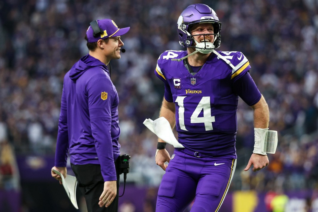 Vikings head coach Kevin O'Connell and quarterback Sam Darnold celebrate a touchdown against the Falcons during the 2024 NFL season.