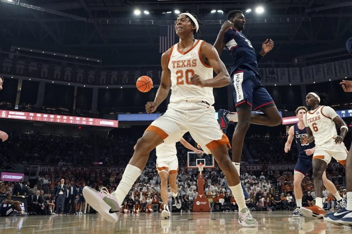 Texas Longhorns guard Tre Johnson (20) reacts after driving to the basket during the second half against the Connecticut Huskies
