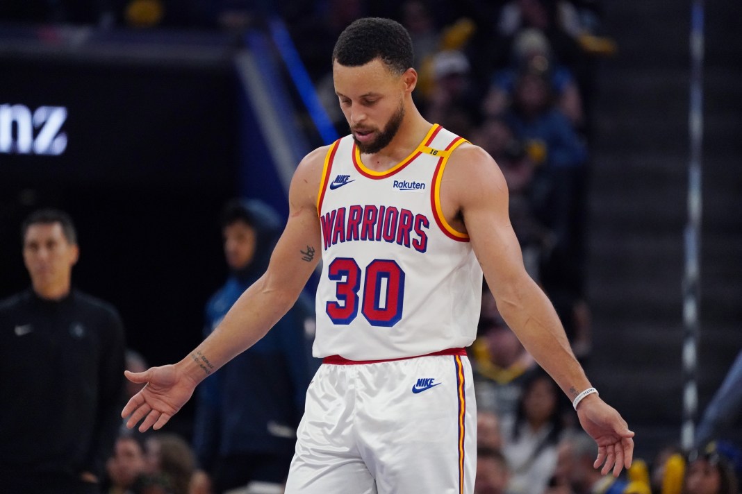 Warriors superstar Stephen Curry looks on against the Timberwolves during the 2024-25 NBA season.