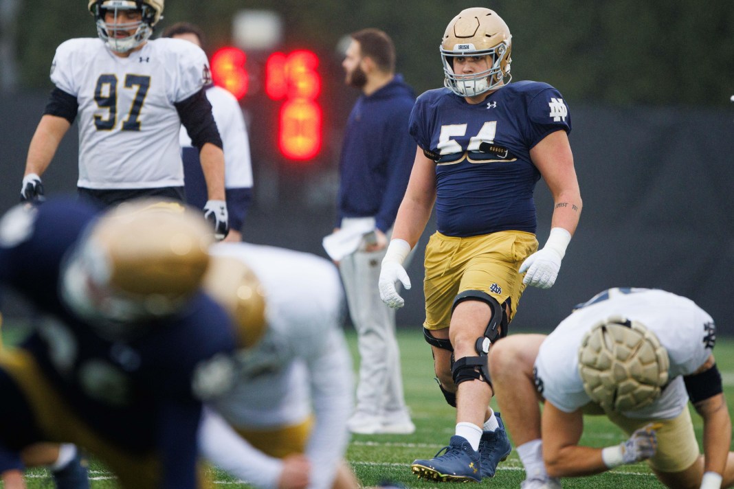 Notre Dame offensive lineman Anthonie Knapp warms up during a Notre Dame football practice