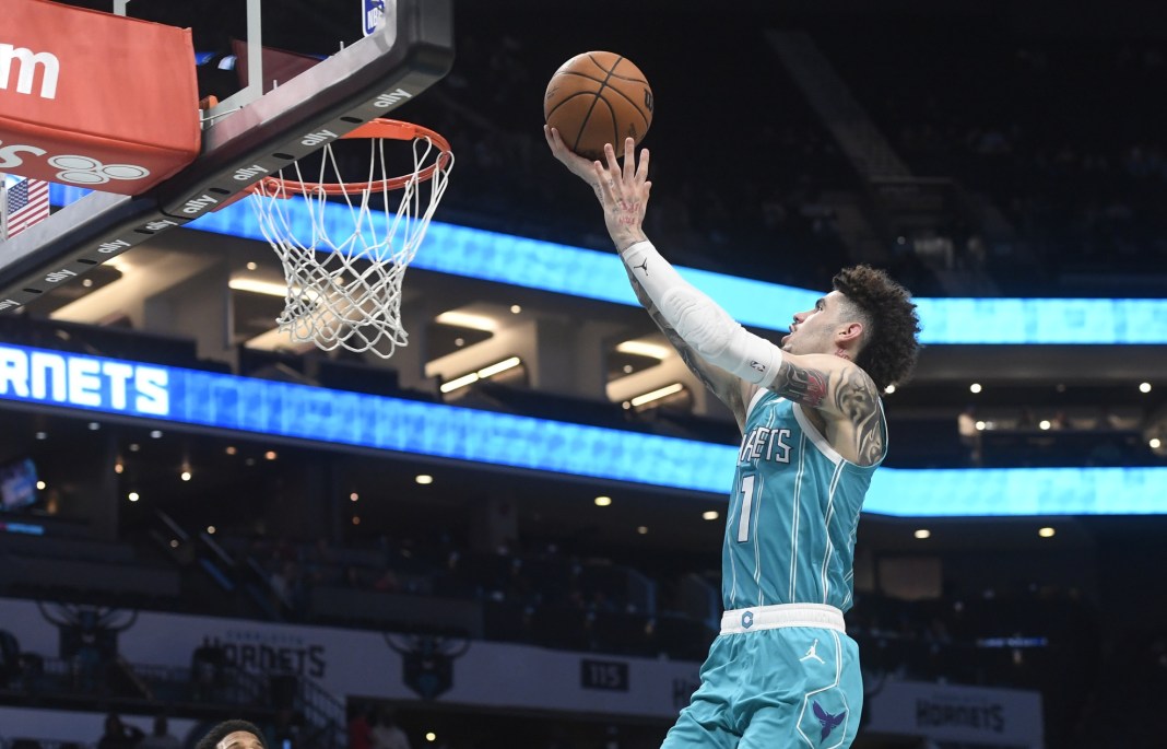 Hornets star LaMelo Ball makes a layup against the 76ers during the 2024-25 NBA season.