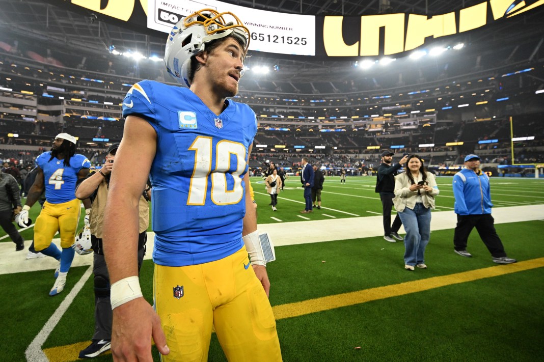 Chargers quarterback Justin Herbert walks off the field after a win over the Broncos during the 2024 NFL season.