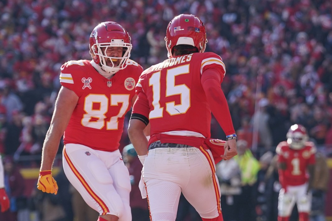 Chiefs stars Travis Kelce and Patrick Mahomes celebrate during a meeting with the Texans in the 2024 NFL season.