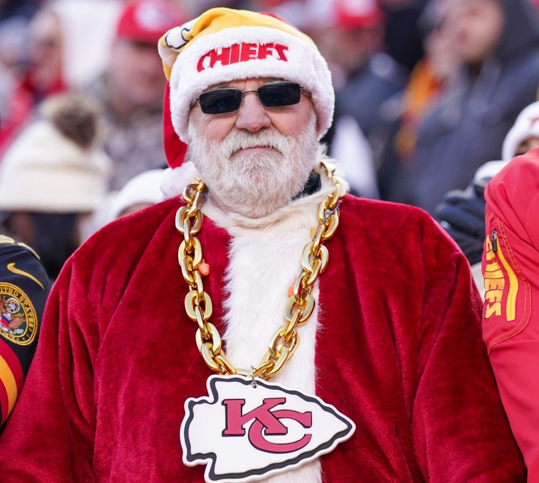 Kansas City Chiefs fan wearing a Santa Claus outfit cheers for the team during the second half of the game against the Houston Texans at Arrowhead Stadium on December 21, 2024