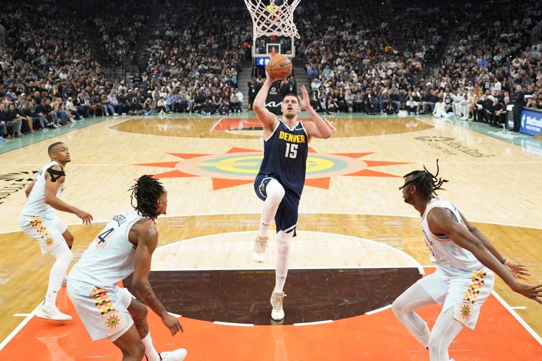 Nuggets superstar Nikola Jokic goes up for a shot against the Spurs.