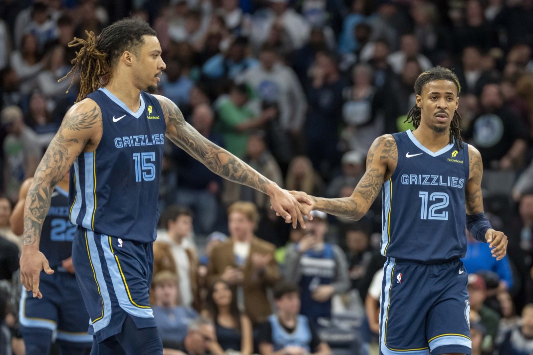 Grizzlies star Ja Morant and Brandon Clarke celebrate a win over the Timberwolves during the 2024-25 NBA season.