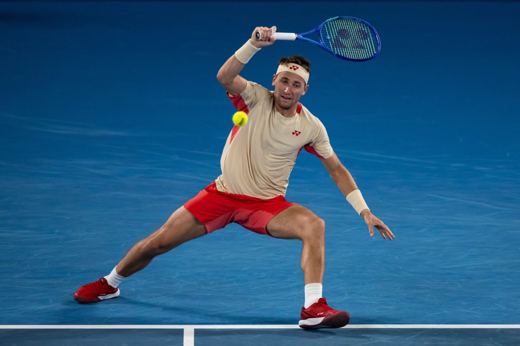 Casper Ruud hits a forehand against Jaume Munar during the 2025 Australian Open.