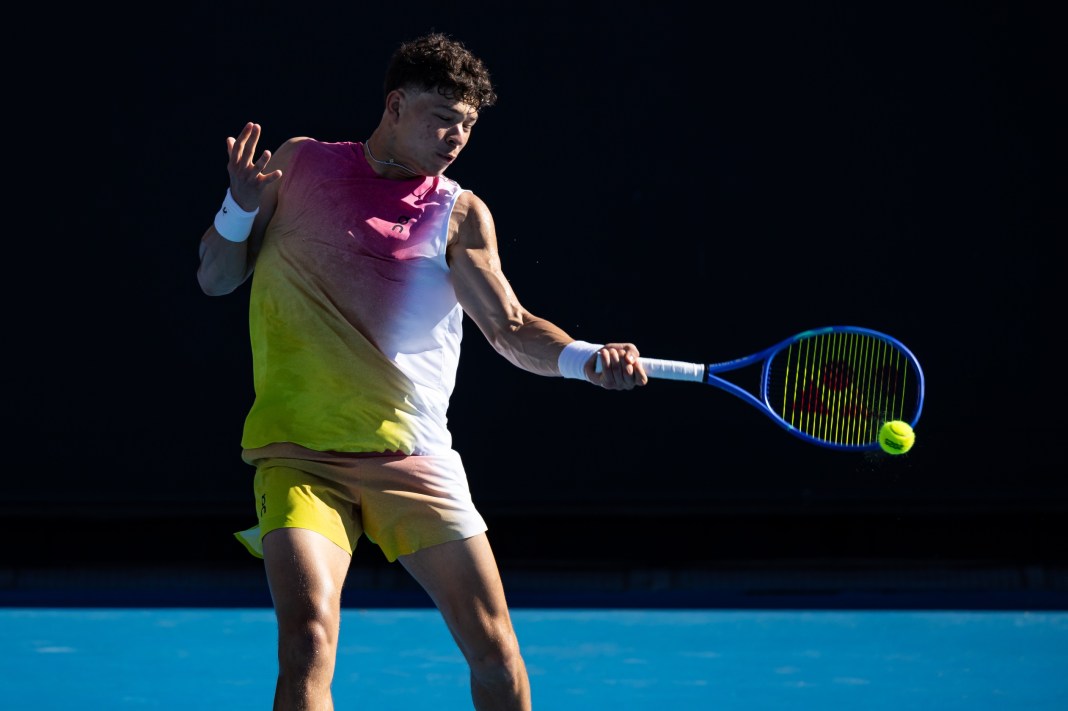 Ben Shelton hits a forehand in his match against Brandon Nakashima at the 2025 Australian Open.