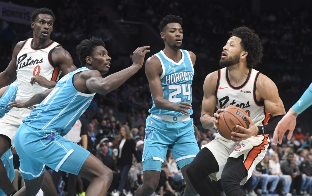 Detroit Pistons guard Cade Cunningham (2) looks to shoot while being defended by the Charlotte Hornets during the first half at the Spectrum Center on November 21, 2024