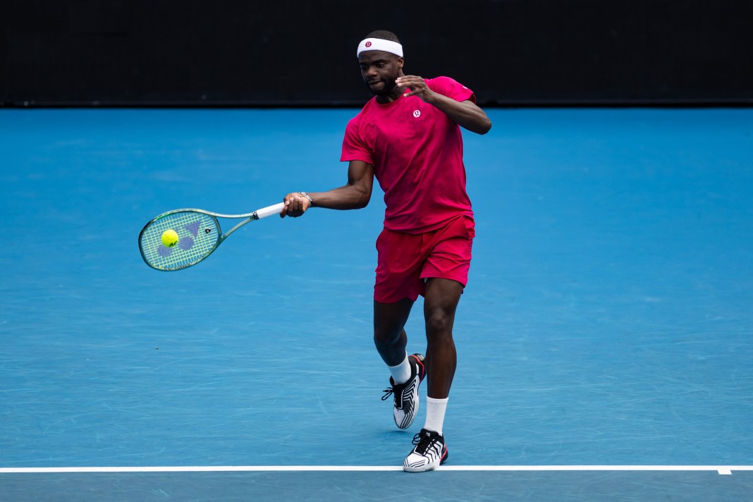 Frances Tiafoe hits a forehand in his match against Fabian Marozsan at the 2025 Australian Open.