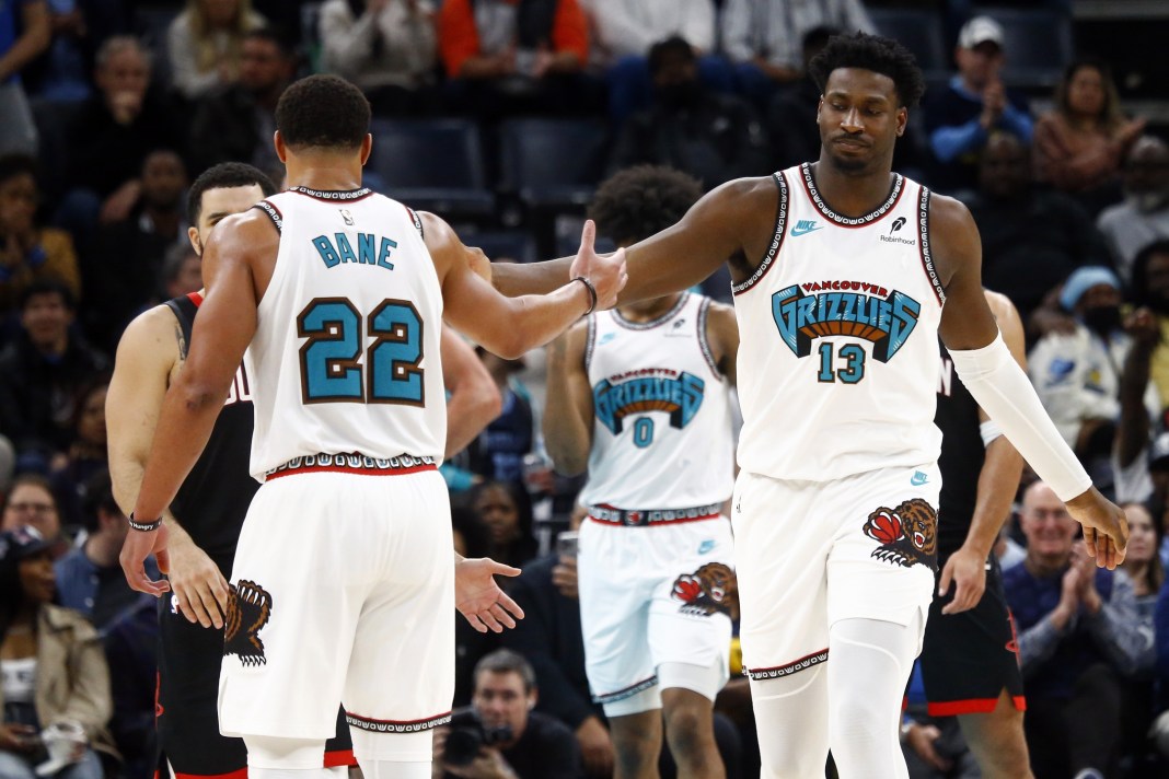 Grizzlies players Jaren Jackson Jr. and Desmond Bane celebrate a big play against the Rockets during the 2024-25 NBA season.