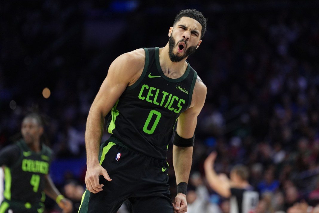 Celtics star Jayson Tatum celebrates a play against the 76ers during the 2024-25 NBA season.