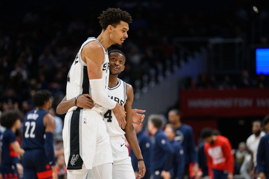 Spurs stars De'Aaron Fox and Victor Wembanyama embraces in a meeting with the Wizards during the 2024-25 NBA season.