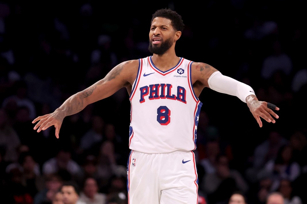 Sixers forward Paul George reacts to a play during a meeting with the Nets in the 2024-25 NBA season.