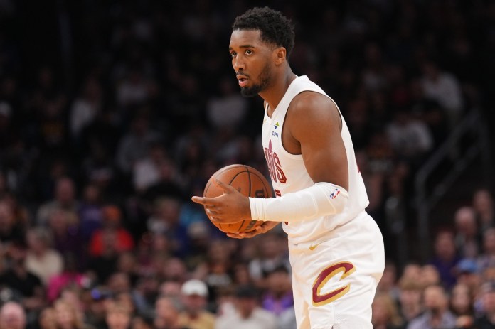 Cleveland Cavaliers guard Donovan Mitchell (45) controls the ball against the Phoenix Suns during the first half at Footprint Center in Phoenix, Arizona, on March 21, 2025.
