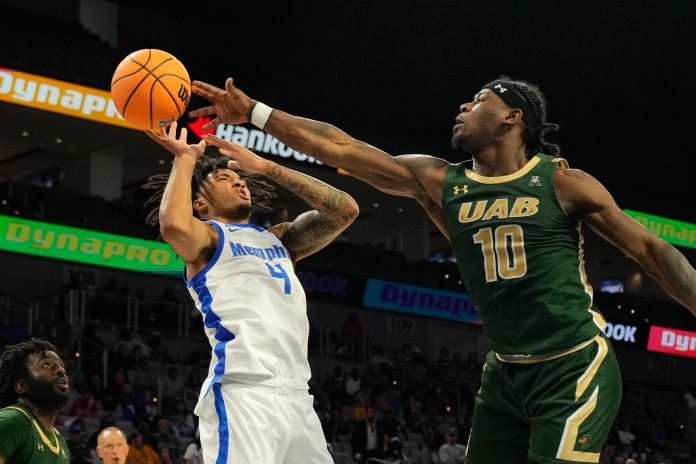 Memphis Tigers guard PJ Haggerty (4) has his shot blocked by UAB Blazers guard Alejandro Vasquez (10) during the second half at Dickies Arena in Fort Worth, TX, on March 16, 2025.