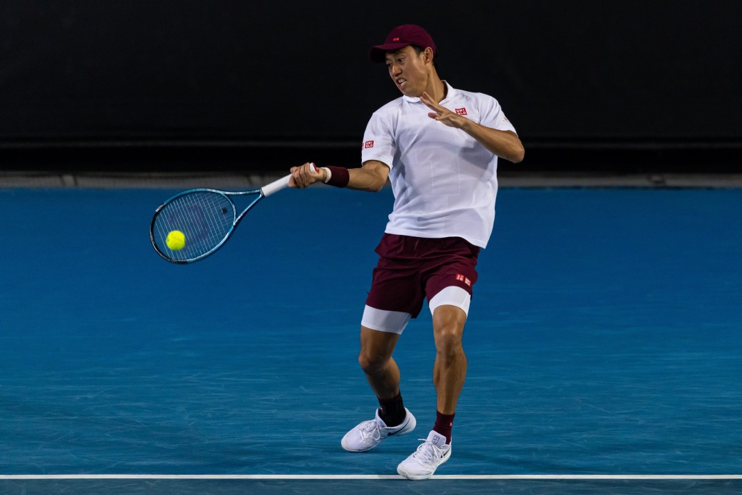 Kei Nishikori hits a forehand at the 2025 Australian Open.