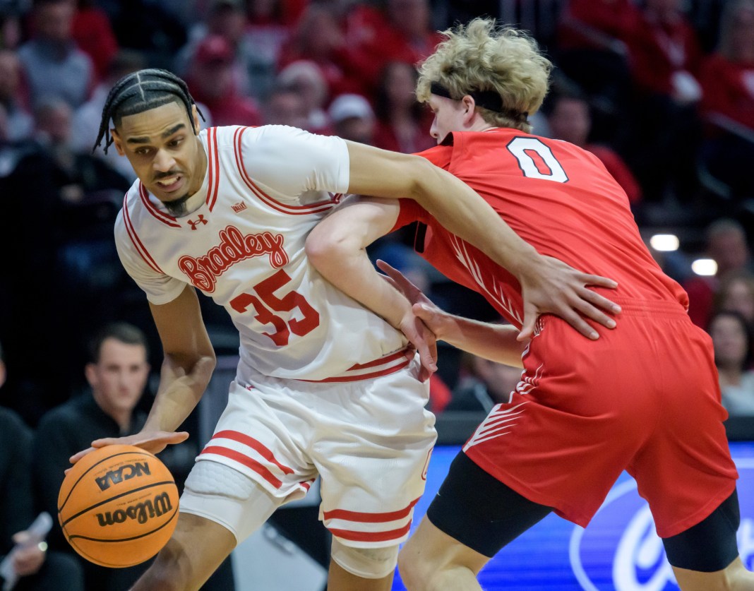 Bradley’s Darius Hannah (35) tries to make a move on ISU’s Jack Daugherty in the first half of their MVC basketball game on January 25, 2025, at Carver Arena in Peoria. The Braves defeated their I-74 rivals 61-57.