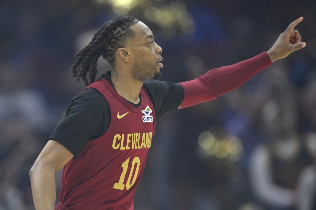 Cavaliers guard Darius Garland points against the Nets during the 2024-25 NBA season.