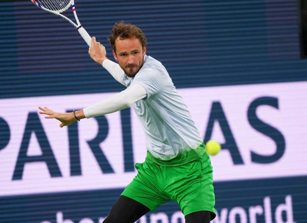 Daniil Medvedev hits a forehand against Tommy Paul at the 2025 BNP Paribas Open in Indian Wells.