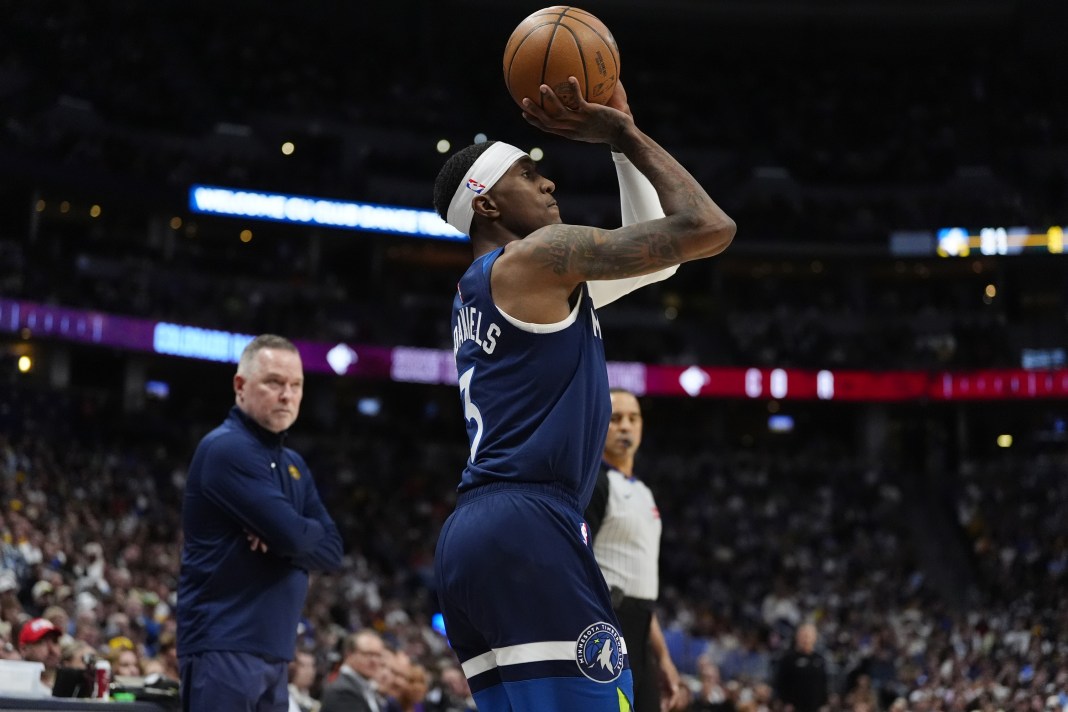 Timberwolves wing Jaden McDaniels takes a jumper against the Nuggets during the 2024-25 NBA season.