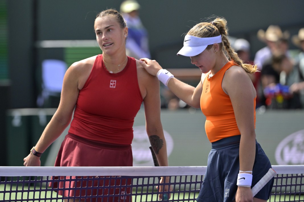 Mirra Andreeva and Aryna Sabalenka meet at the net after the 2025 BNP Paribas Open final in Indian Wells.