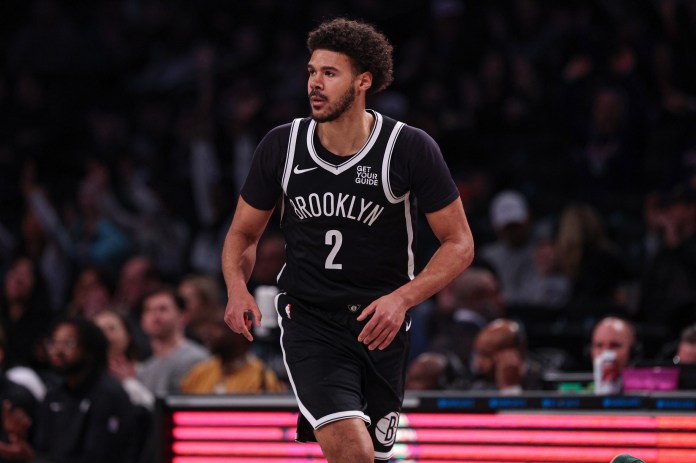 Nets forward Cam Johnson runs the court against the Hawks during the 2024-25 NBA season.