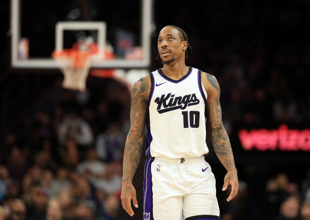 Kings wing DeMar DeRozan walks around against the Suns during the 2024-25 NBA season.