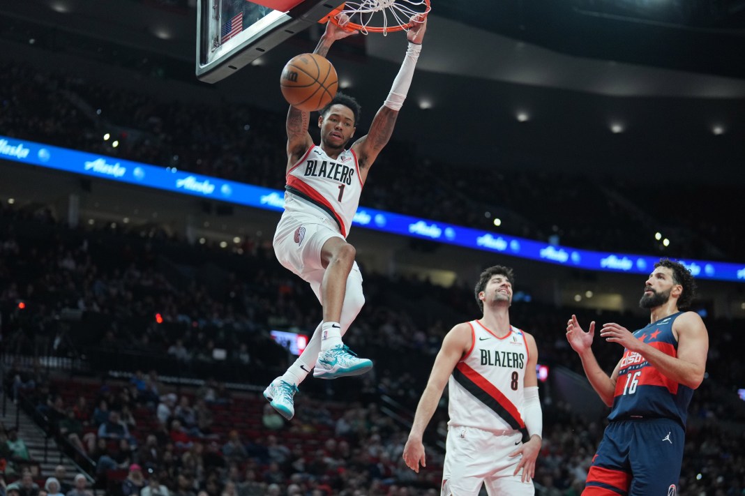 Blazers guard Anfernee Simons dunks against the Wizards during the 2024-25 NBA season.