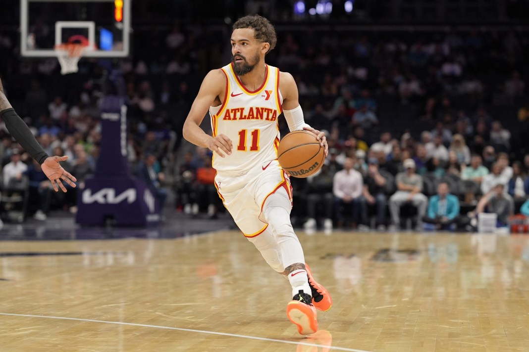 Hawks star Trae Young brings the ball up against the Hornets during the 2024-25 NBA season.