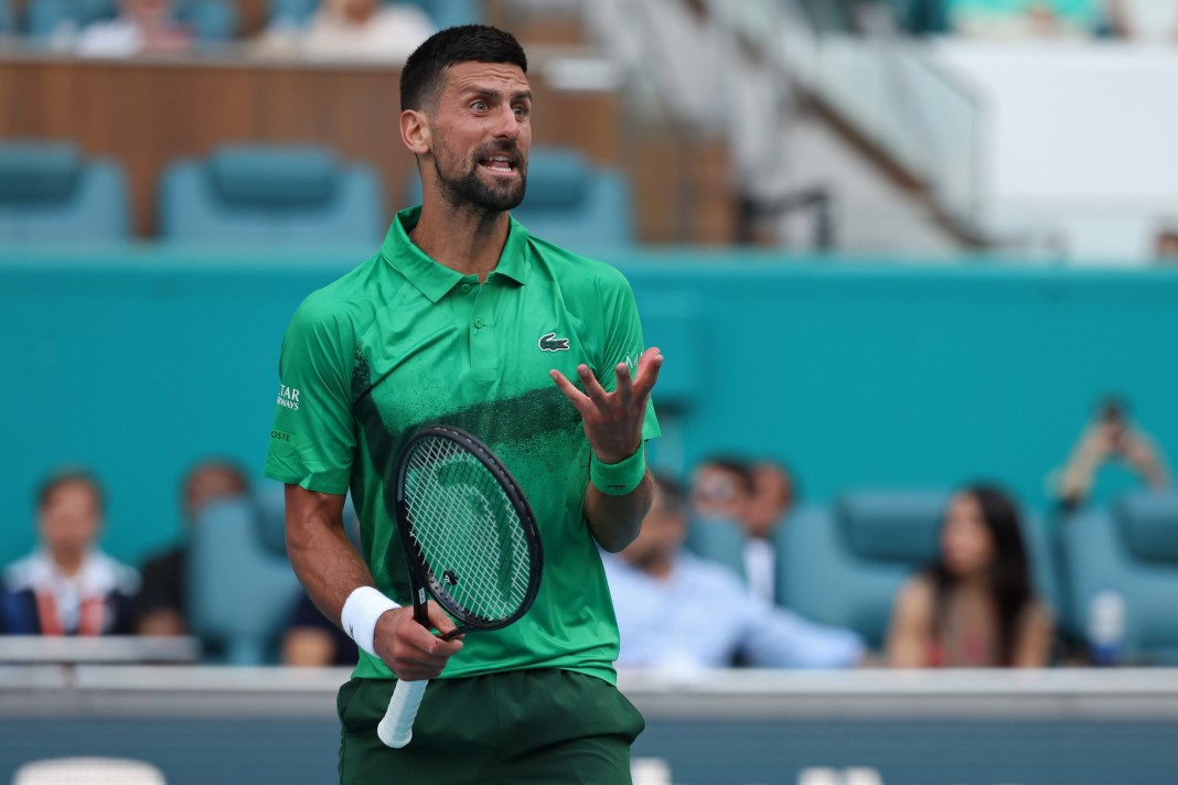 Novak Djokovic reacts to a point in his match against Camilo Ugo Carabelli during the 2025 Miami Open.