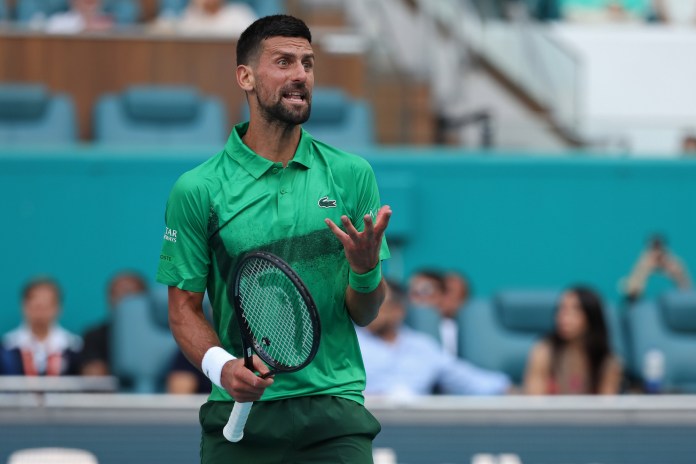 Novak Djokovic reacts to a point in his match against Camilo Ugo Carabelli during the 2025 Miami Open.